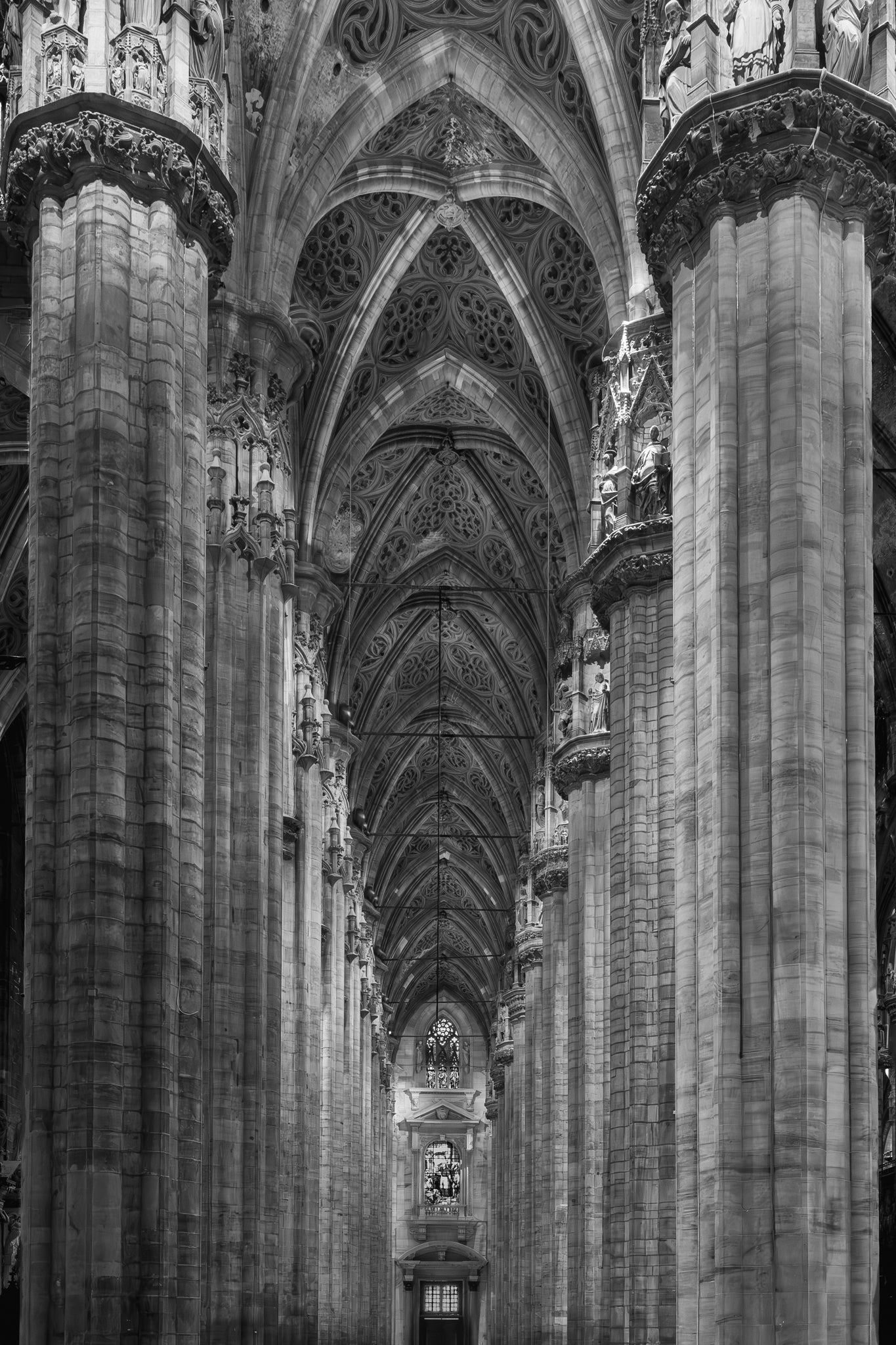 Gothic cathedral interior with tall stone arches and intricate details