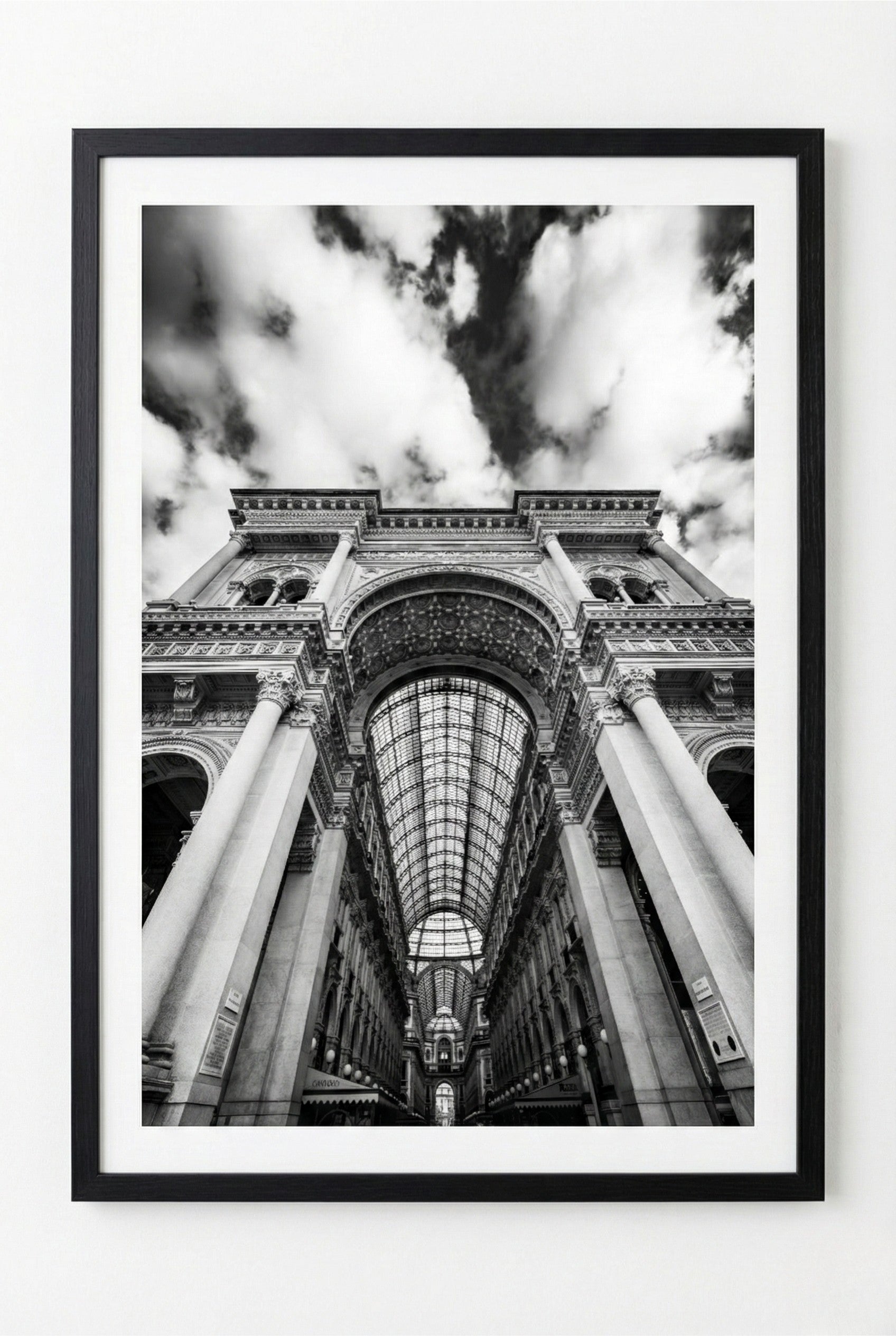 Framed black and white photograph of a architectural interior with columns and arches.