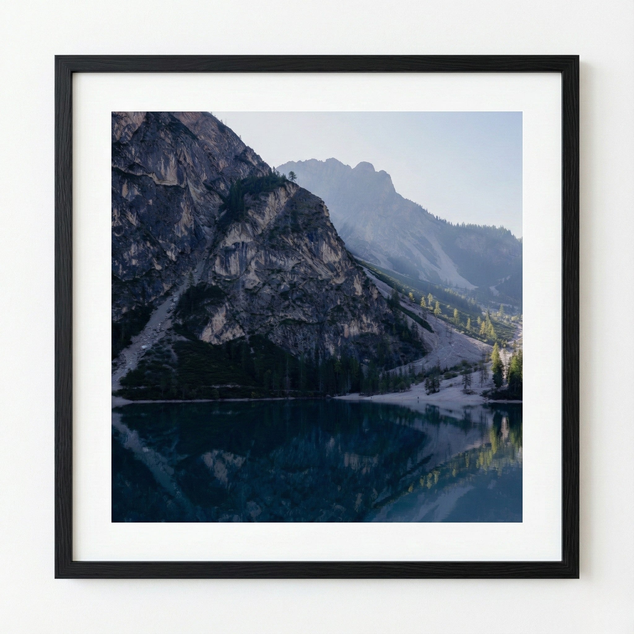 Framed photograph of a mountain landscape with a lake
