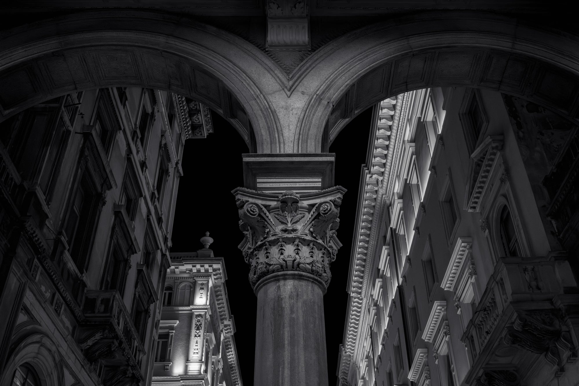 Monochrome architectural scene with columns and detailed stonework