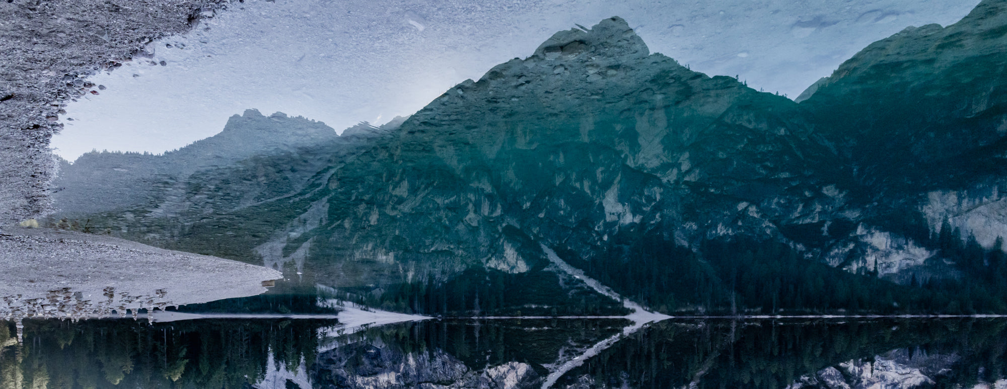 Mountain landscape with a lake reflecting the peaks