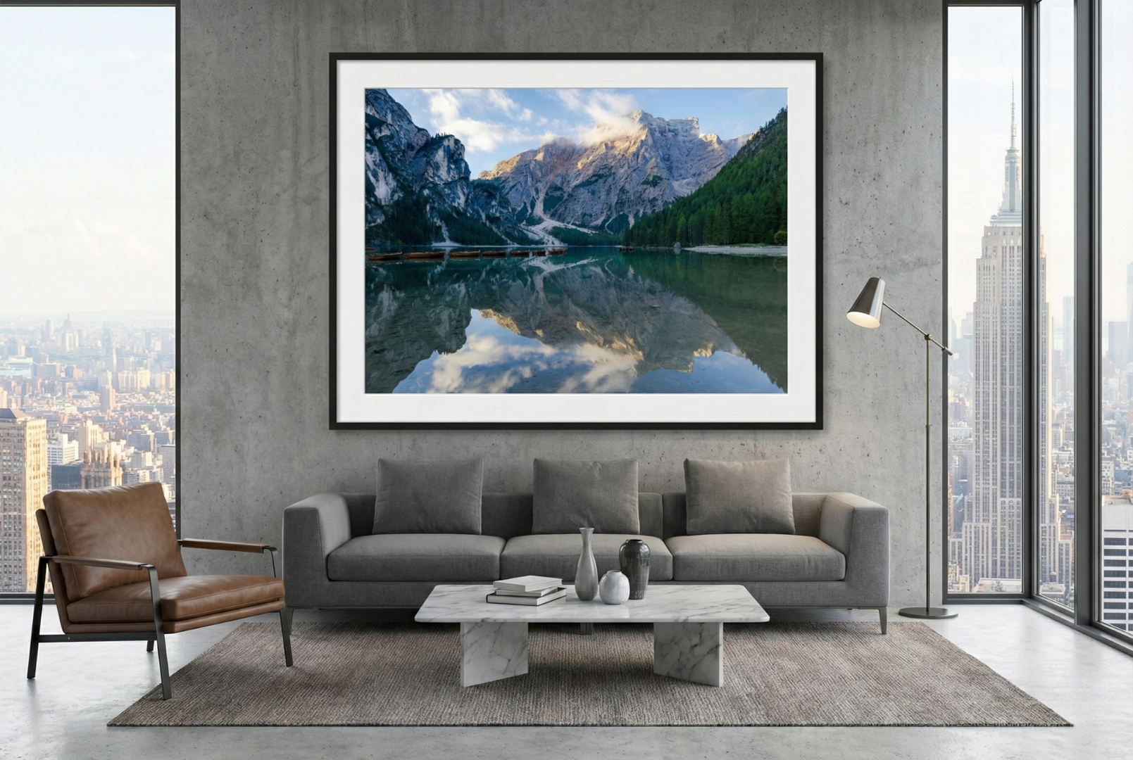 Living room with a large framed photograph of a mountain landscape on the wall.