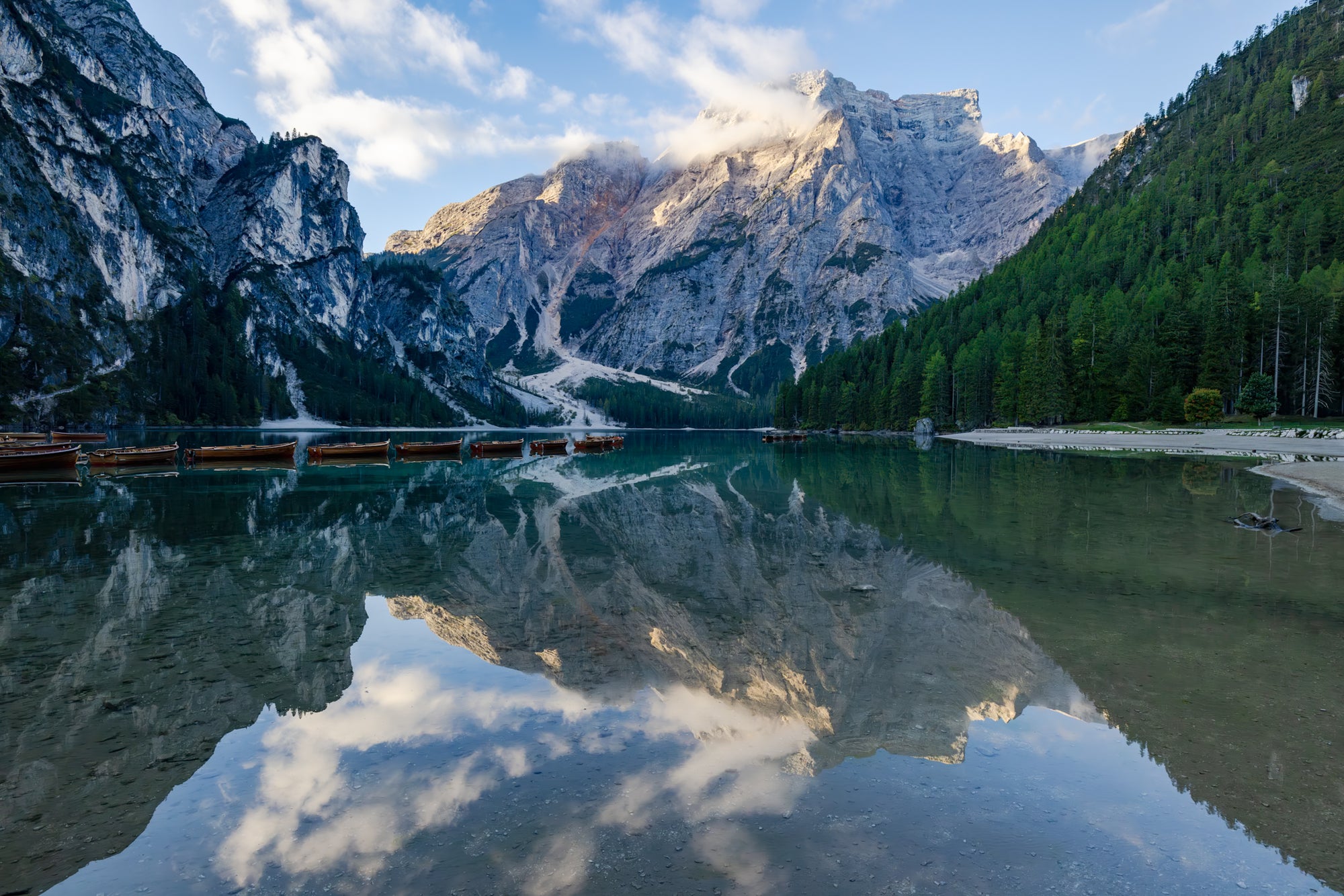 Mountainous landscape with a lake reflecting the peaks