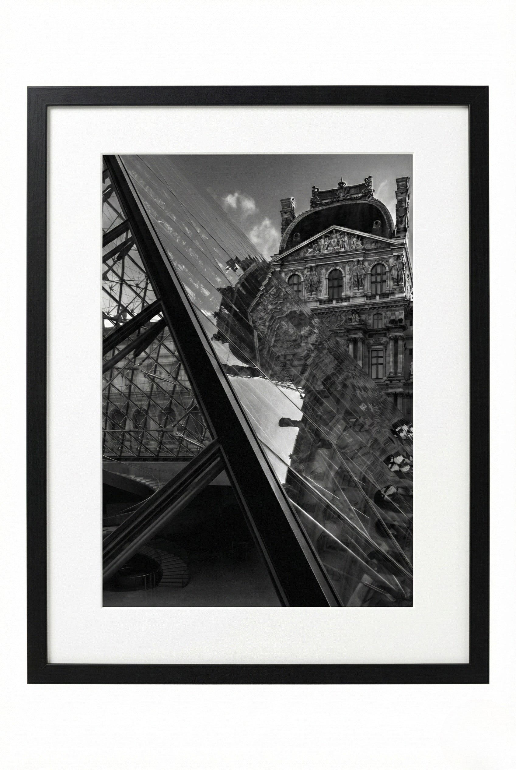 Framed black and white photograph of a building with a glass structure.