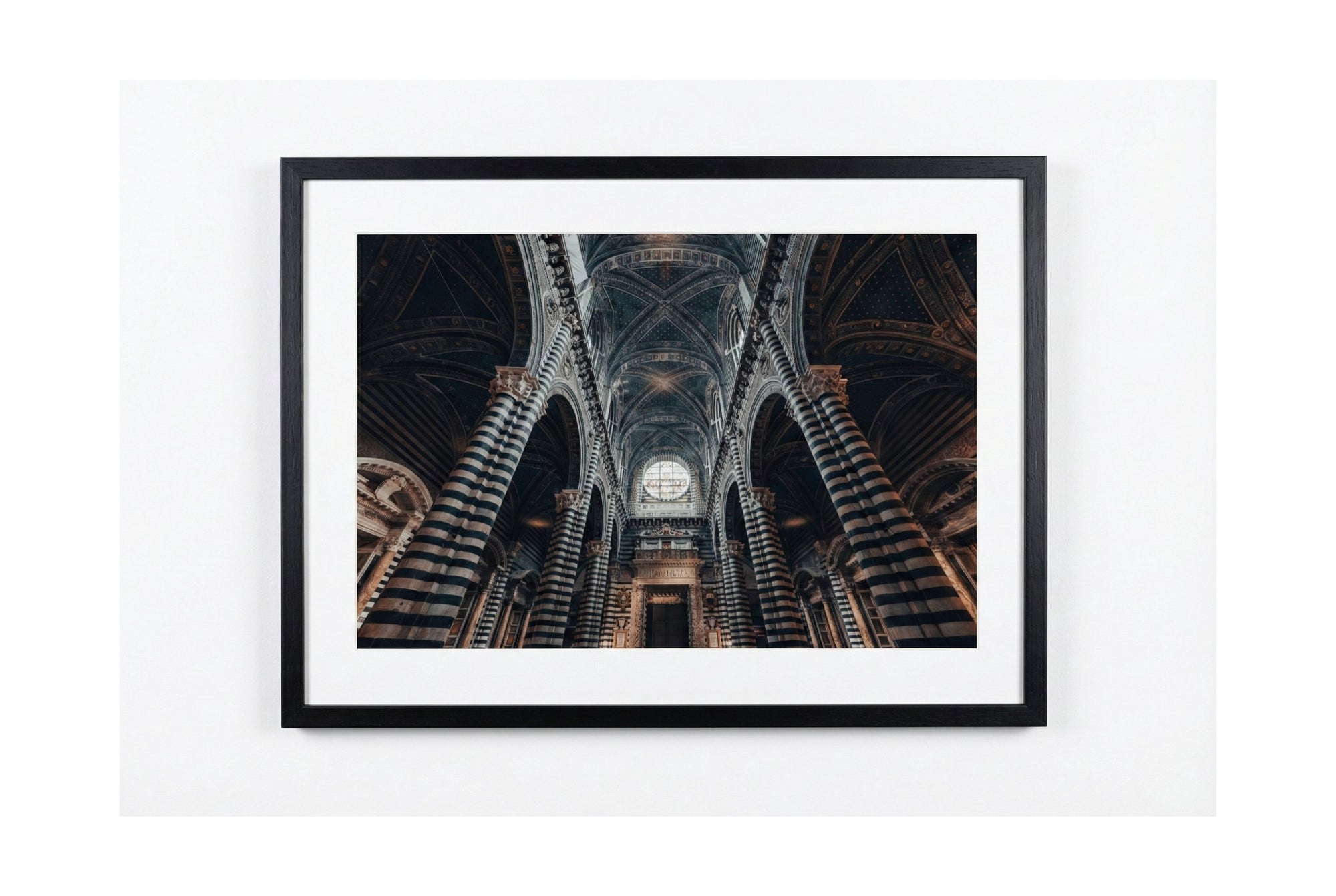 Framed photograph of a cathedral interior on a white background