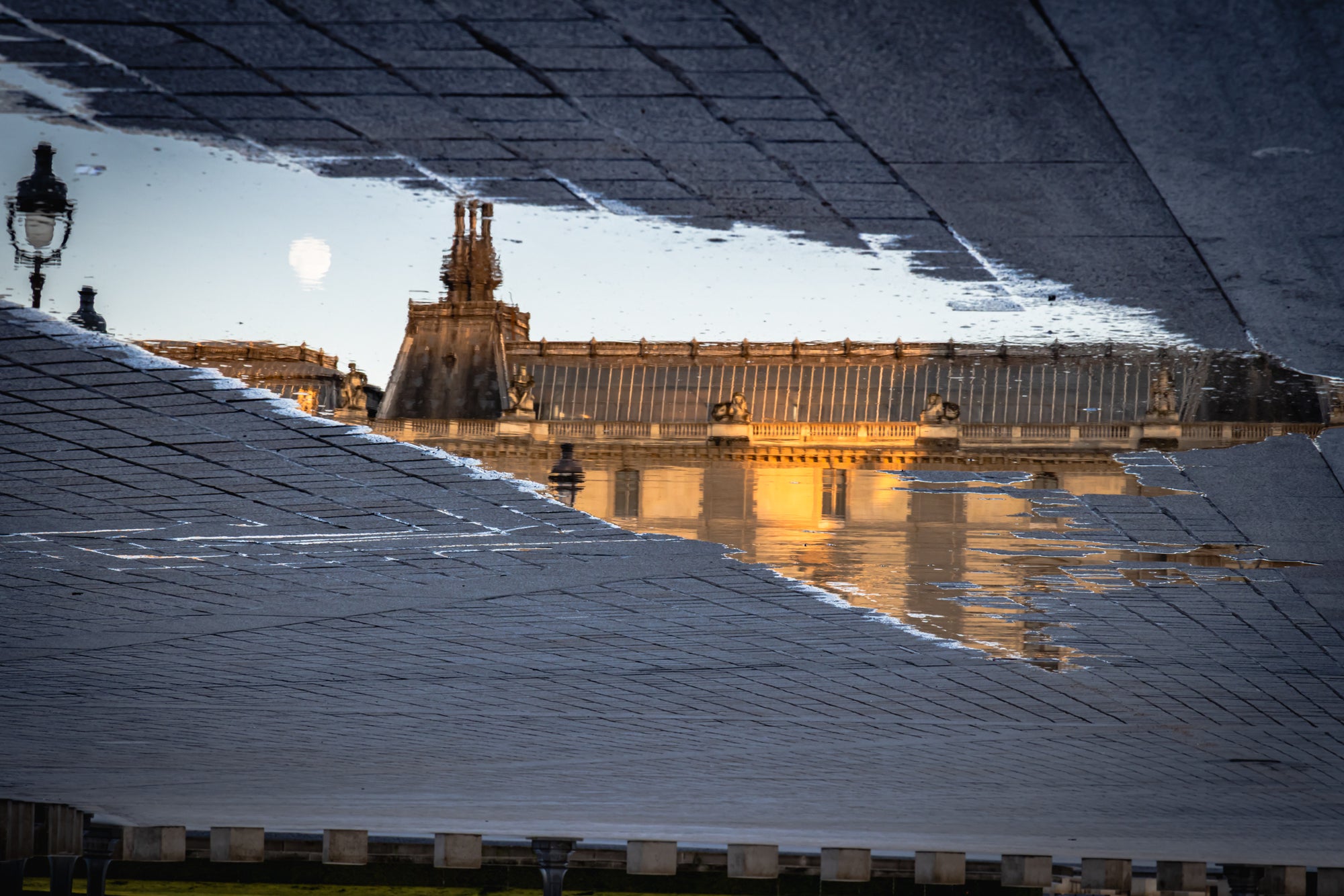 Reflective pavement with a building reflection in the evening