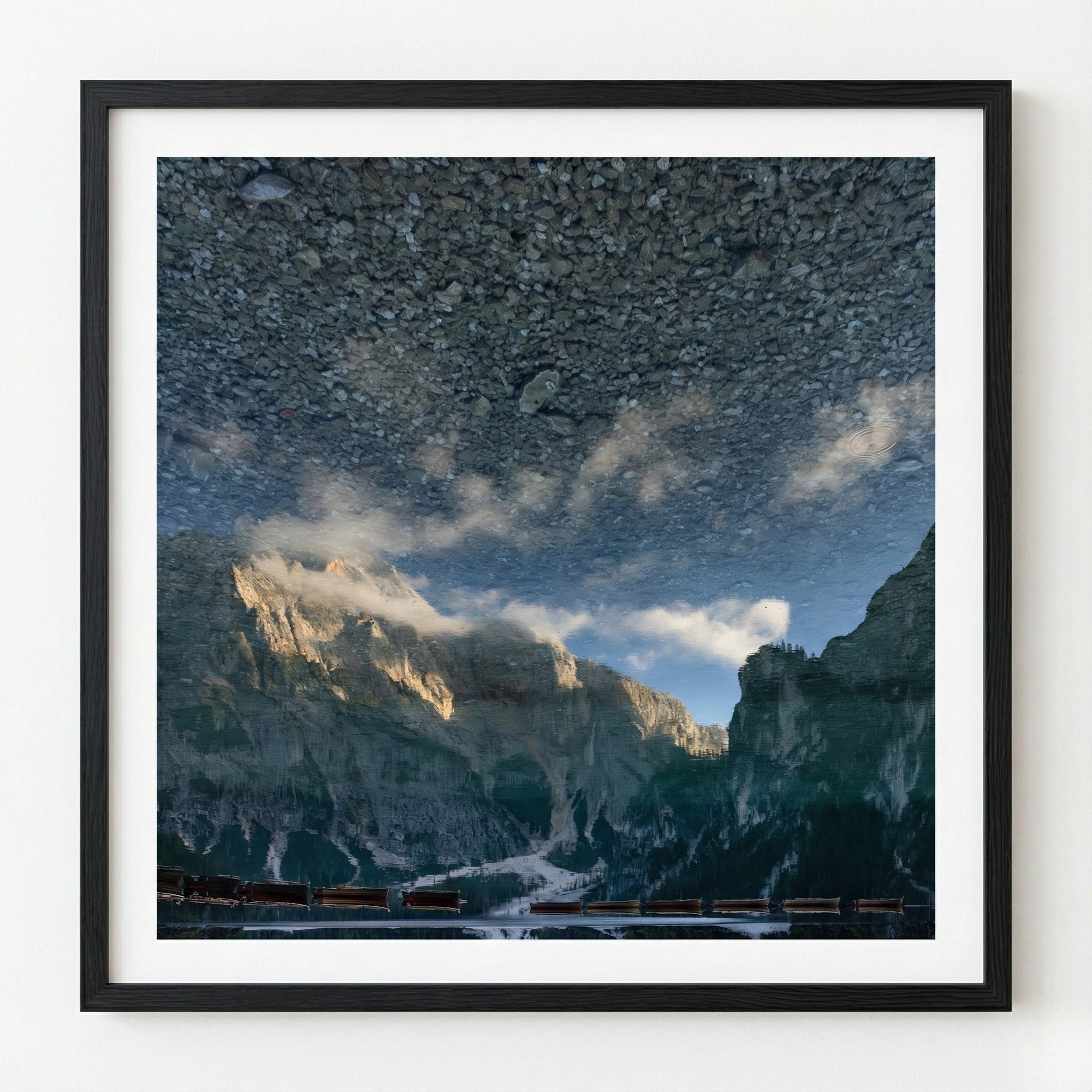 Framed photograph of a mountain landscape with clouds
