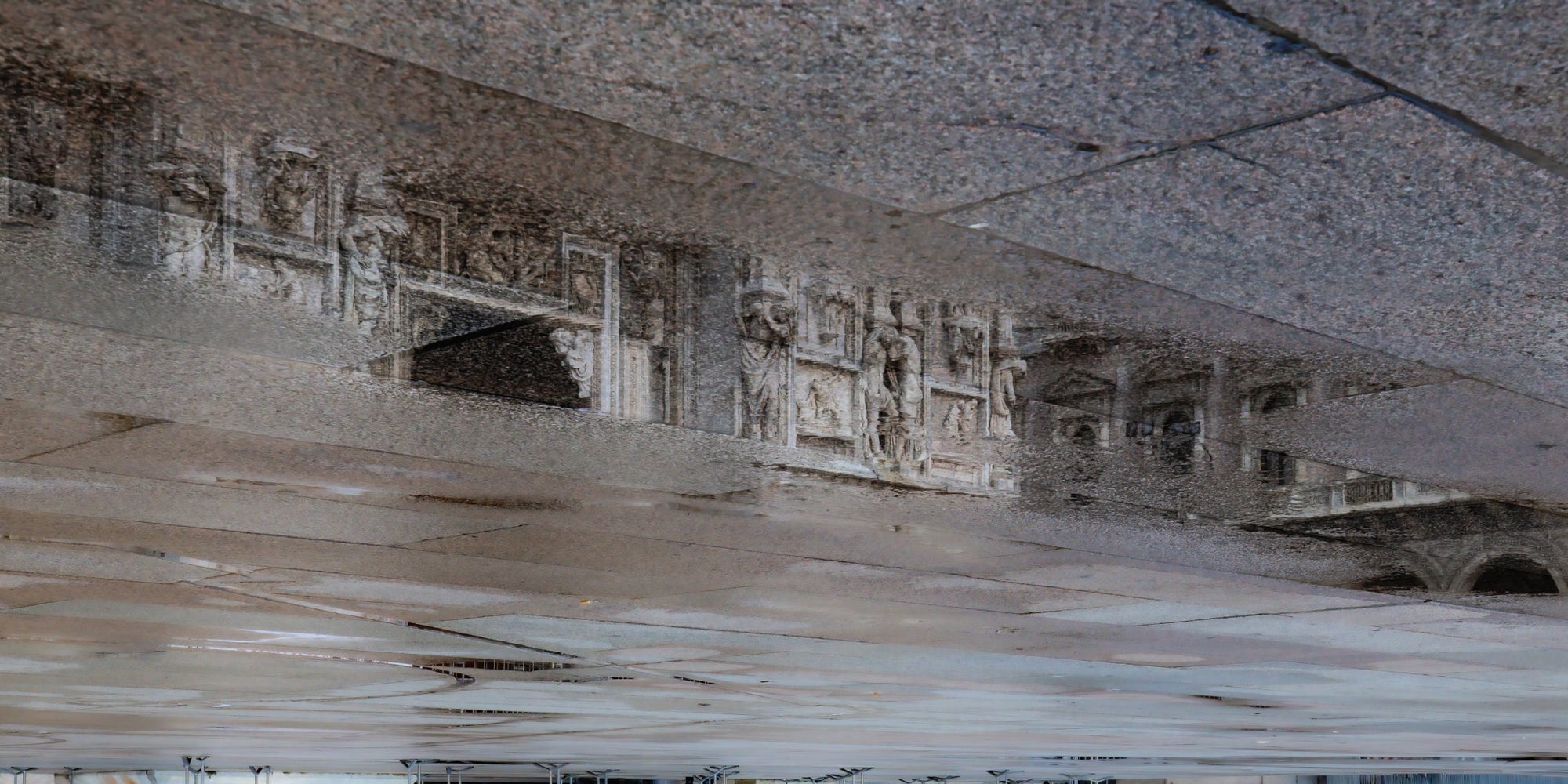 Reflective surface with architectural elements and ceiling texture