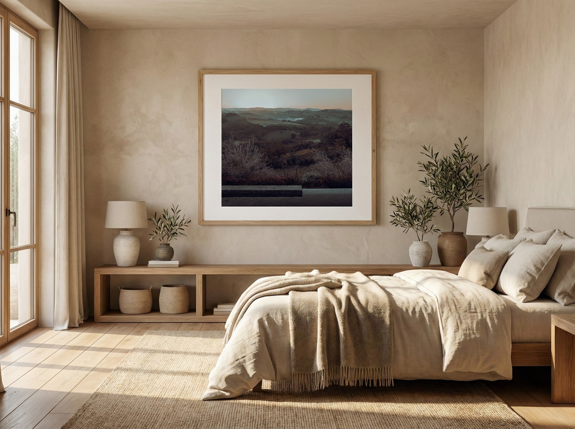 Modern bedroom with a bed, side tables, and wall art.