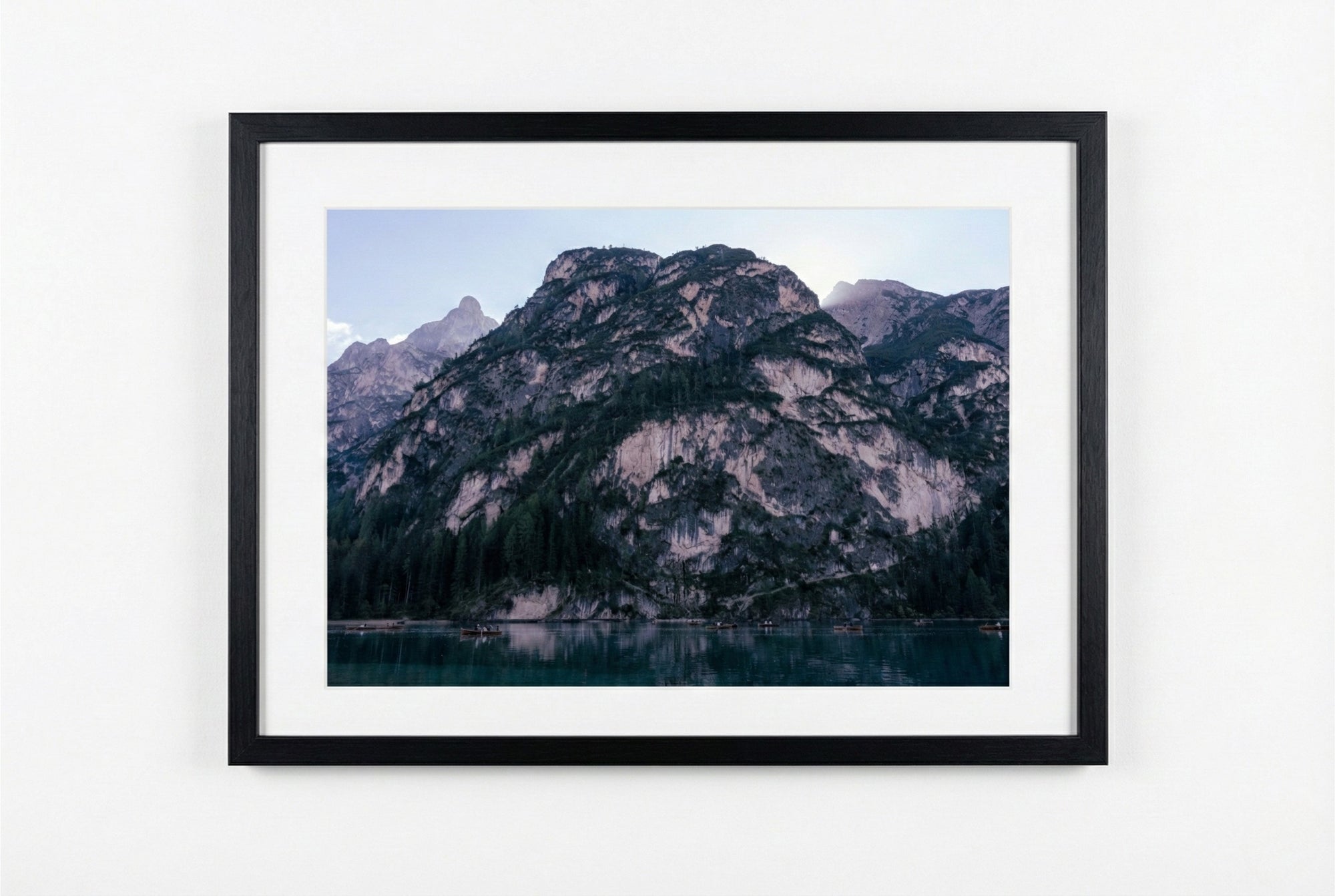 Framed photograph of a mountain landscape with a lake.