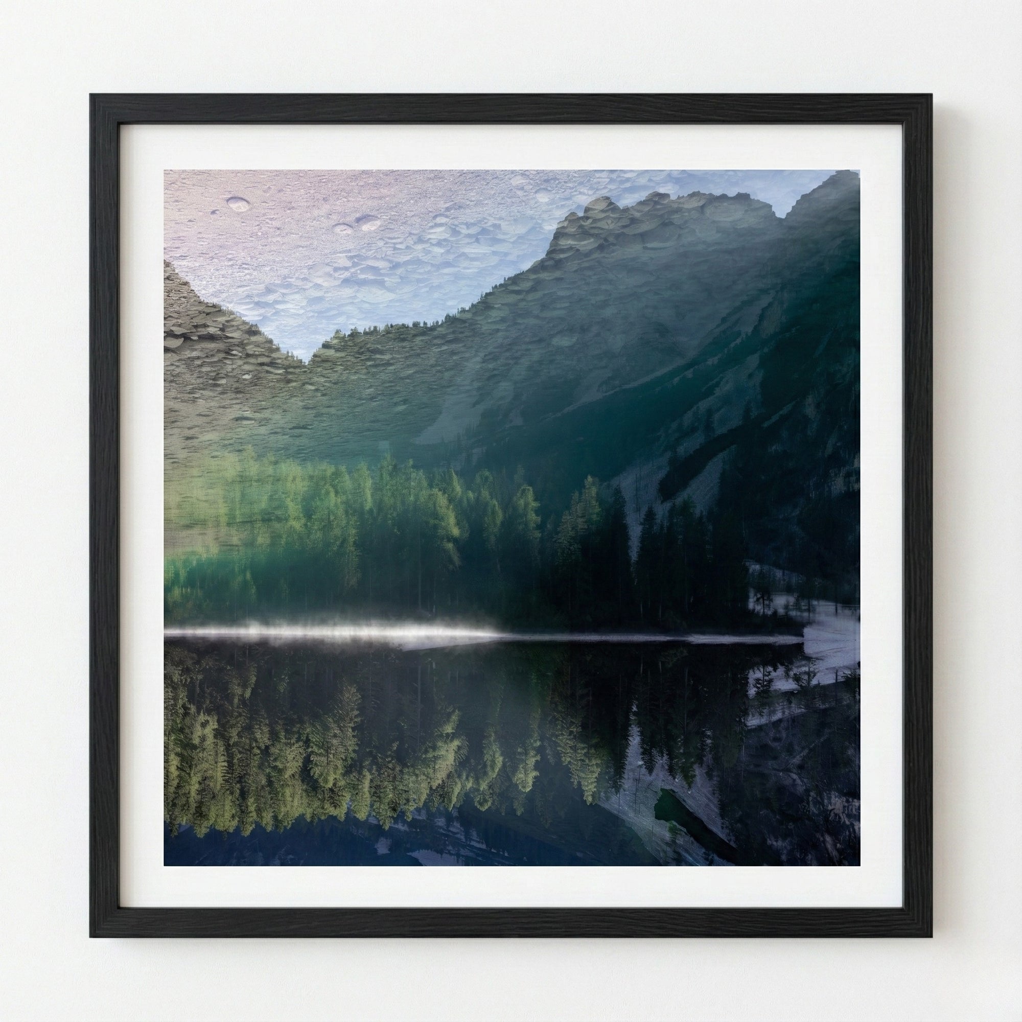 Framed photograph of a mountain landscape with a lake