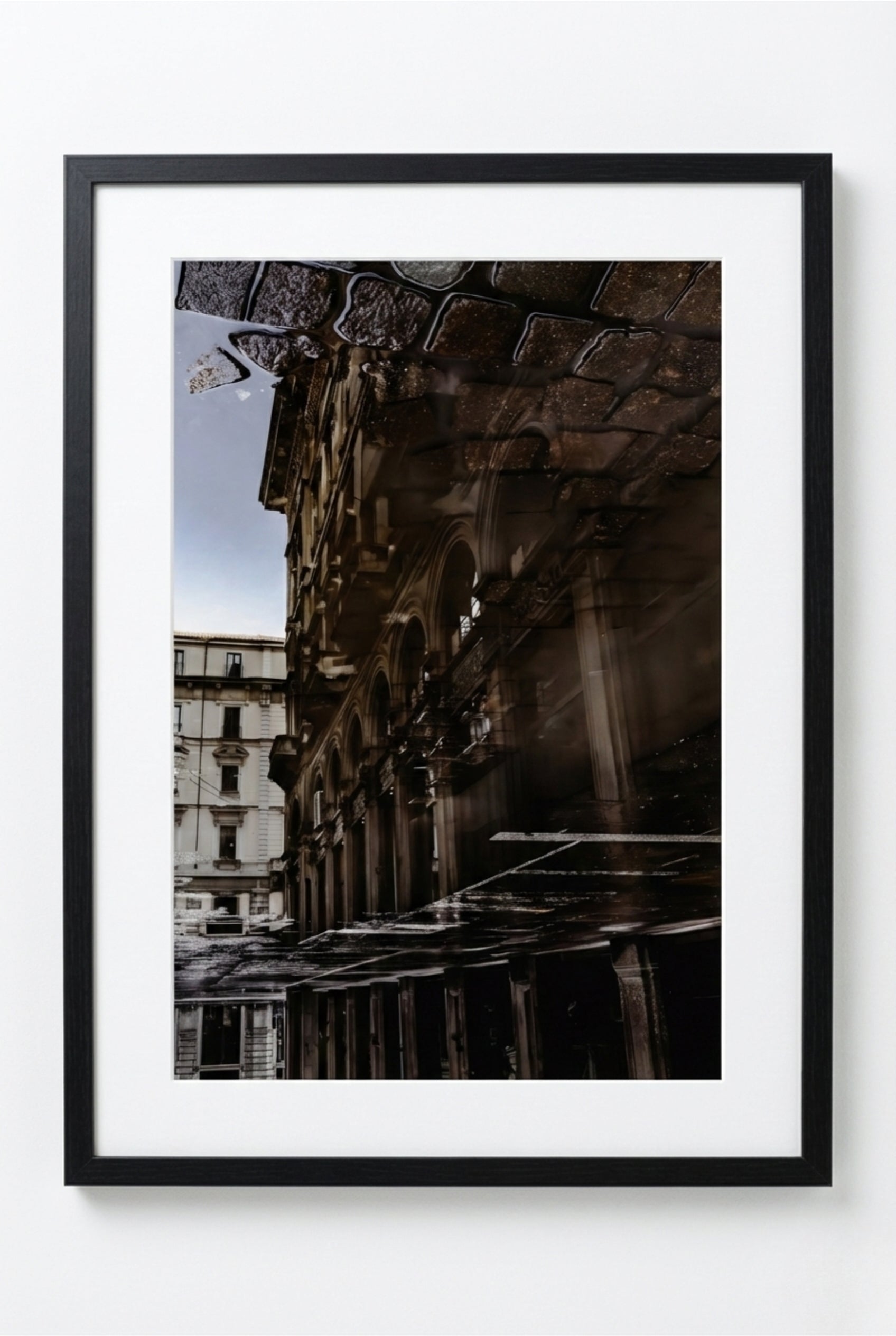 Framed photograph of an urban scene with architectural details
